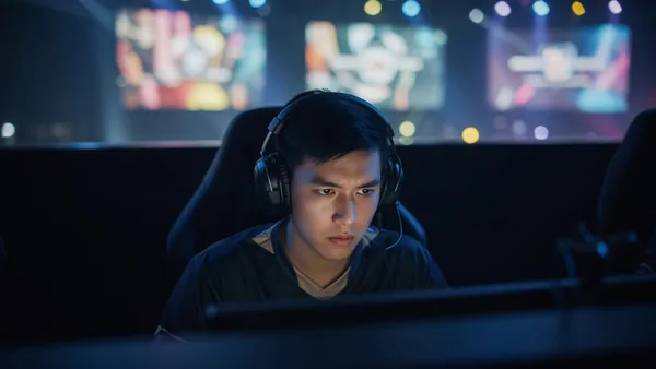 Editorial portrait of an esports player in a team jersey