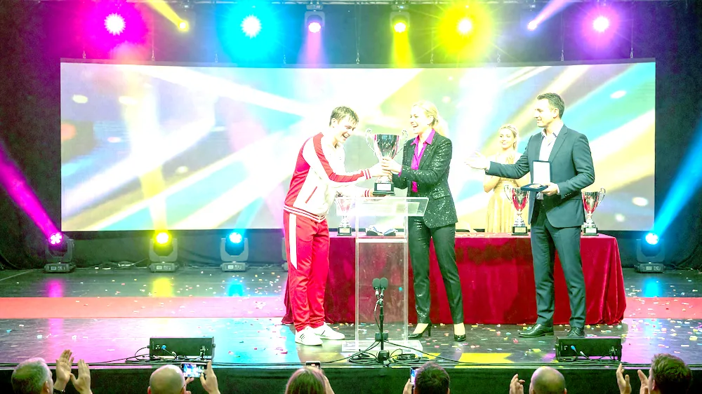Sable players on the award ceremony stage under tournament lights